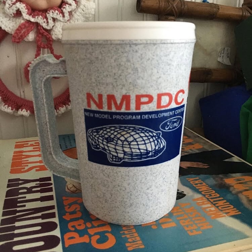 N M P D C plastic mug